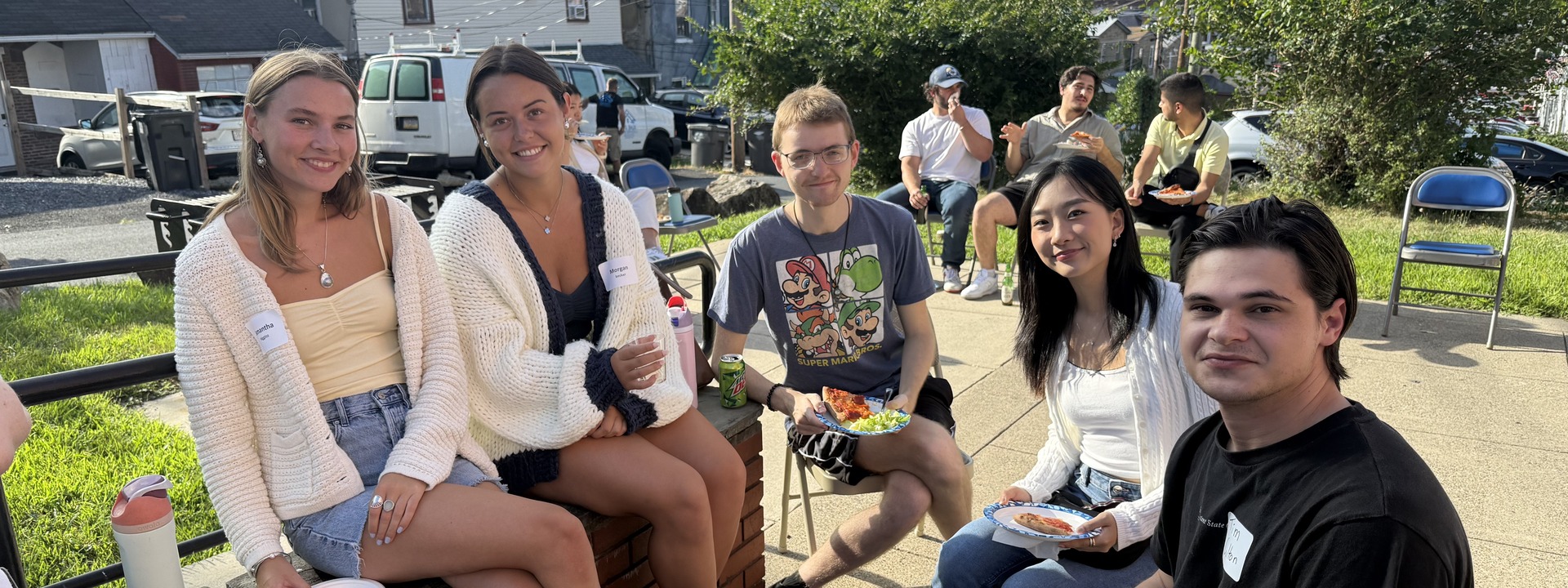 Graduate students meeting each other outside